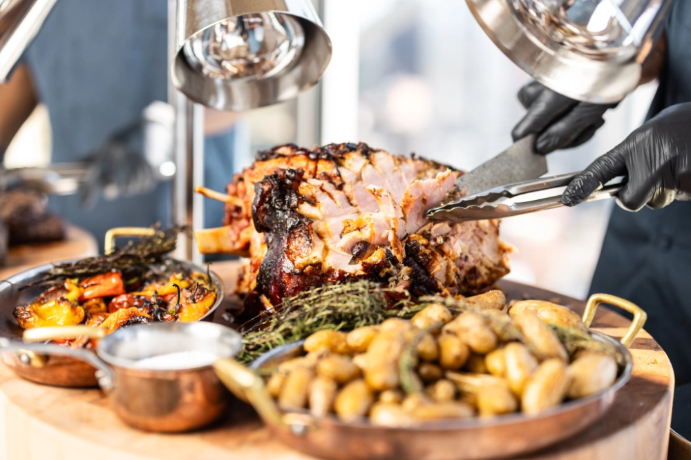 Bone-In Smoked Ham hand carved at live carving station at Crown Block Dallas Sunday Brunch.